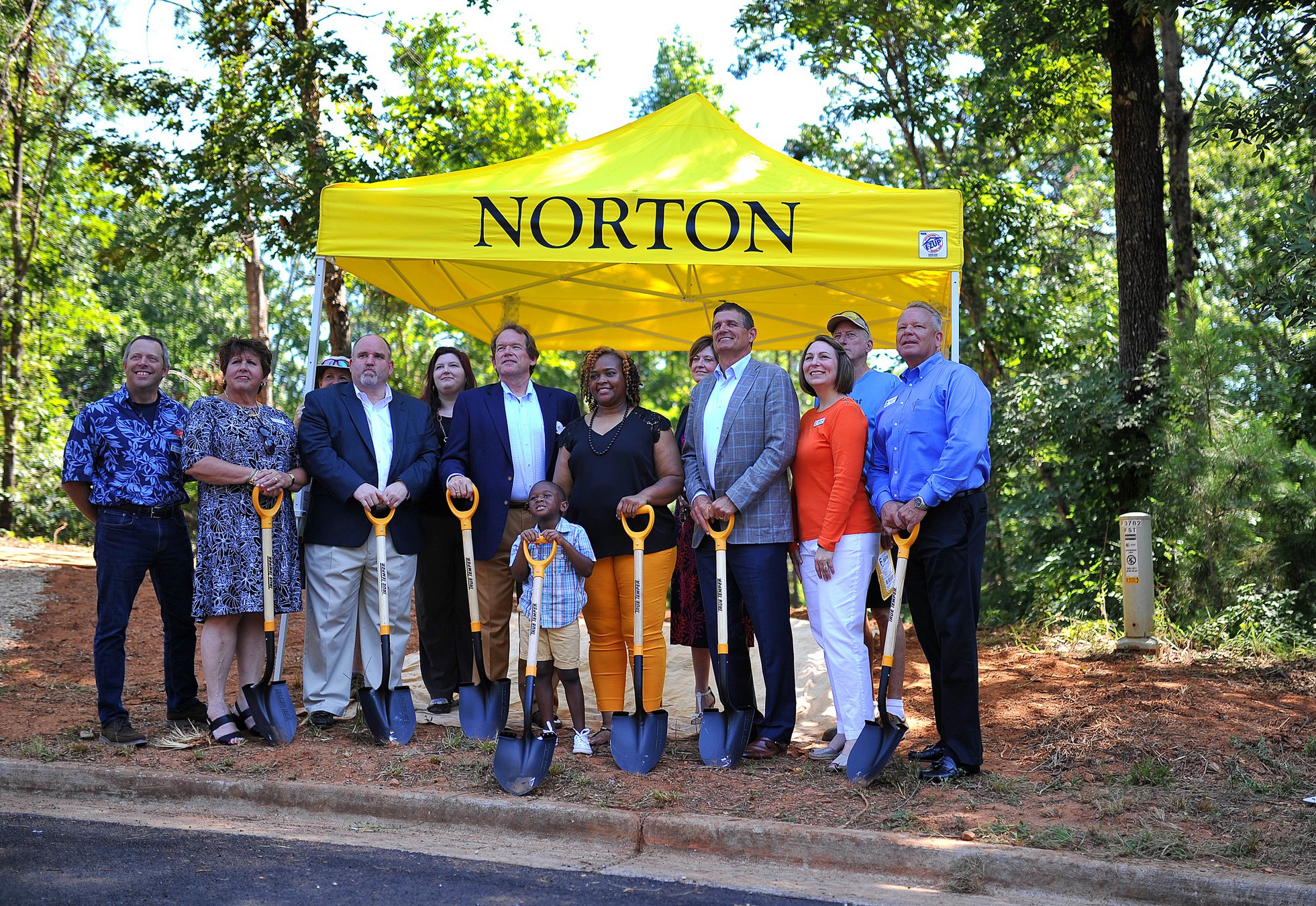 Norton Agency celebrates turning 90 by building Habitat home