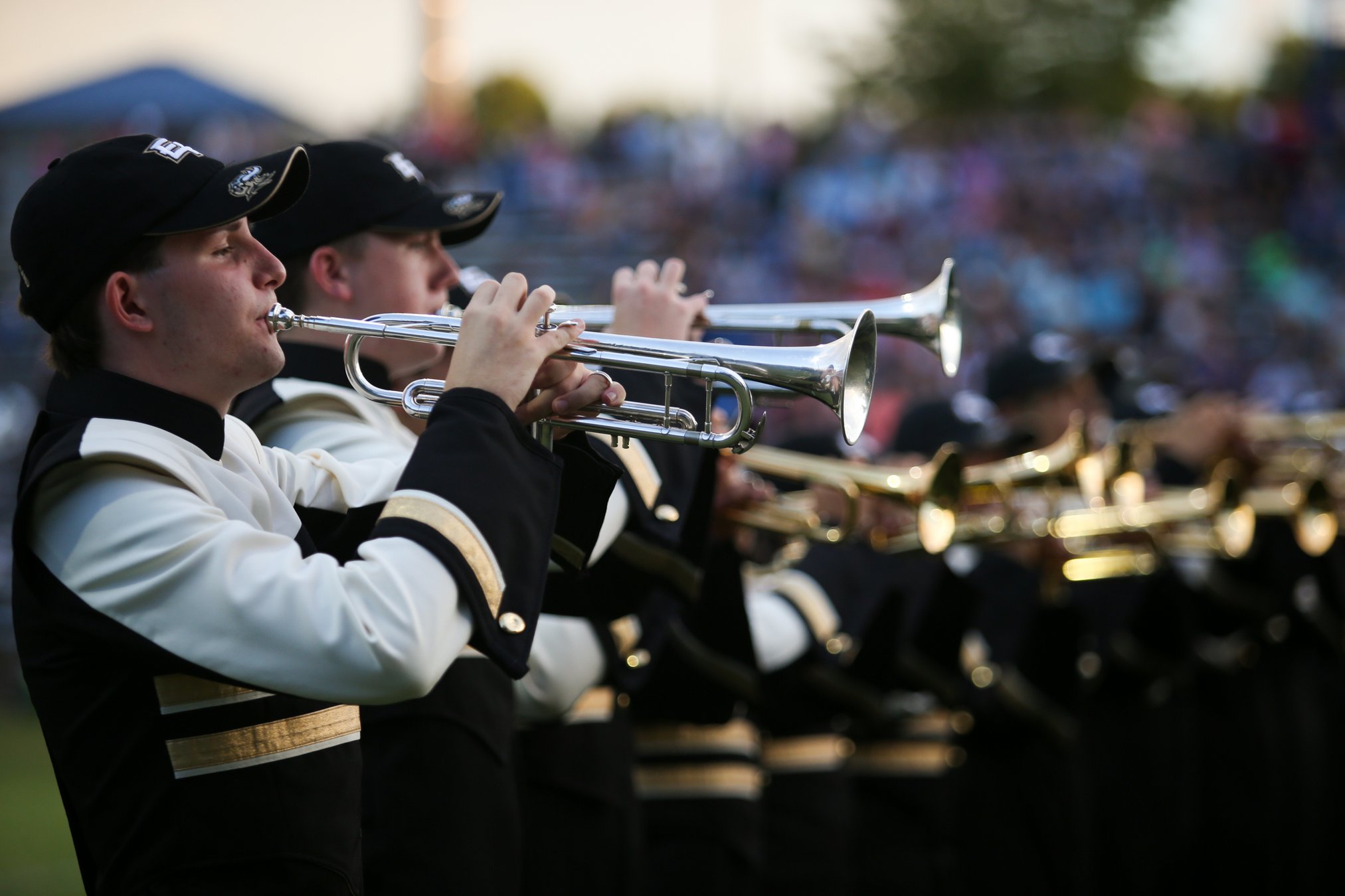 They were marching band director and student. Now these 2 men both lead