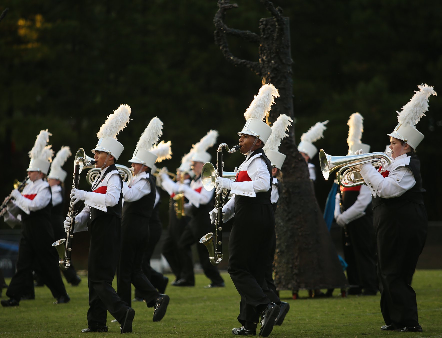 They were marching band director and student. Now these 2 men both lead