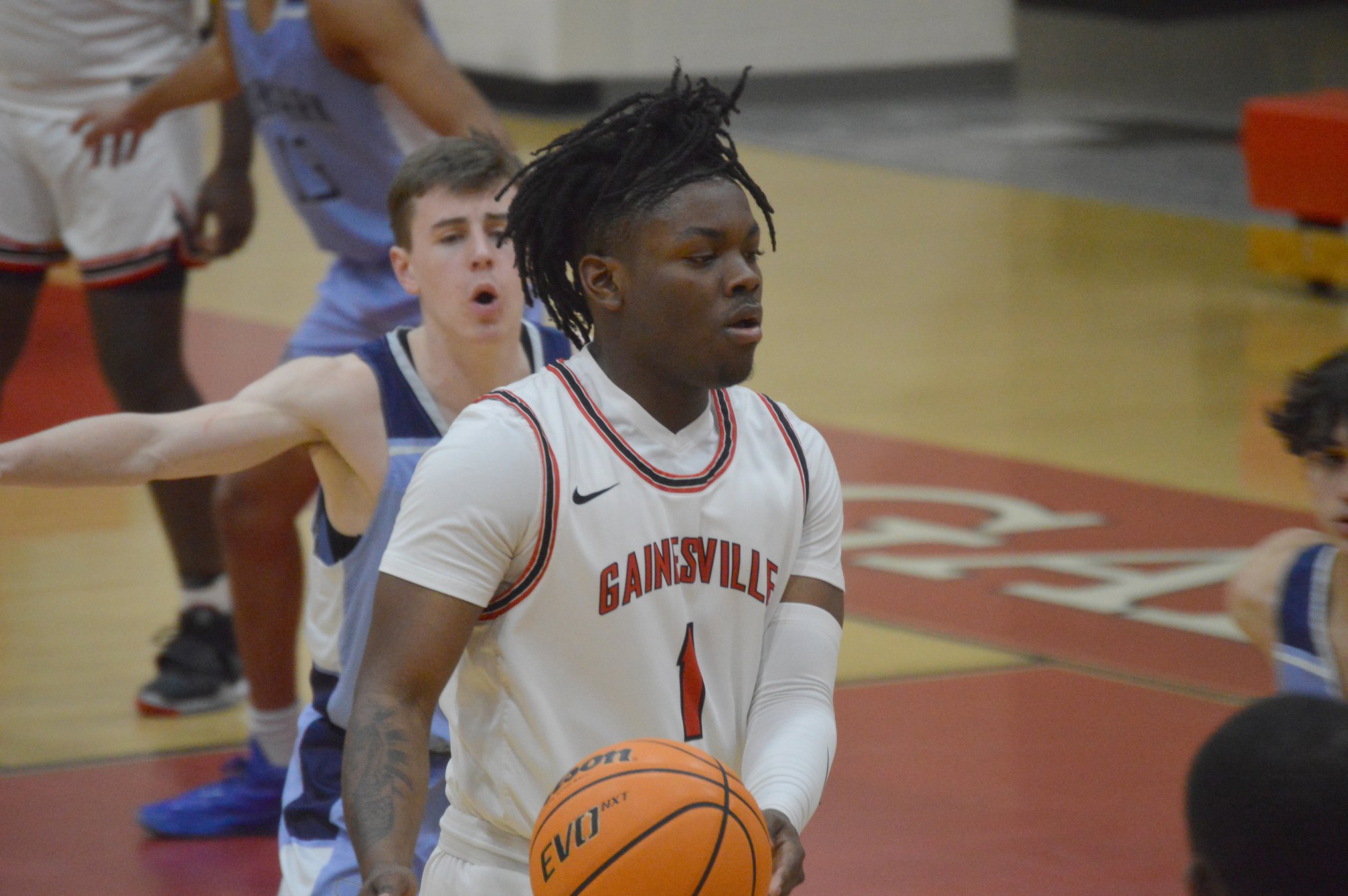 High school basketball Gainesville boys win lowscoring battle, lock