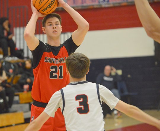 High school basketball: Gainesville boys fight off Milton to keep season-long winning streak alive