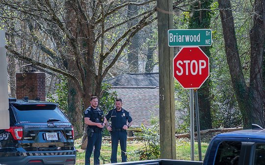 Gainesville police chief credits ‘God’s hand’ after bullet struck officer's radio just below throat during deadly standoff
